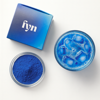 Hydra by FYN Wellness — vibrant blue spirulina drink prepared in glass, cellular hydration