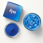 Hydra by FYN Wellness — vibrant blue spirulina drink prepared in glass, cellular hydration